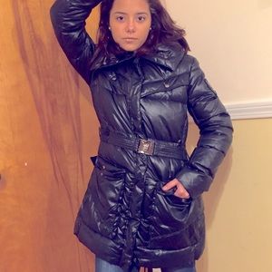 Black, thigh length coat.